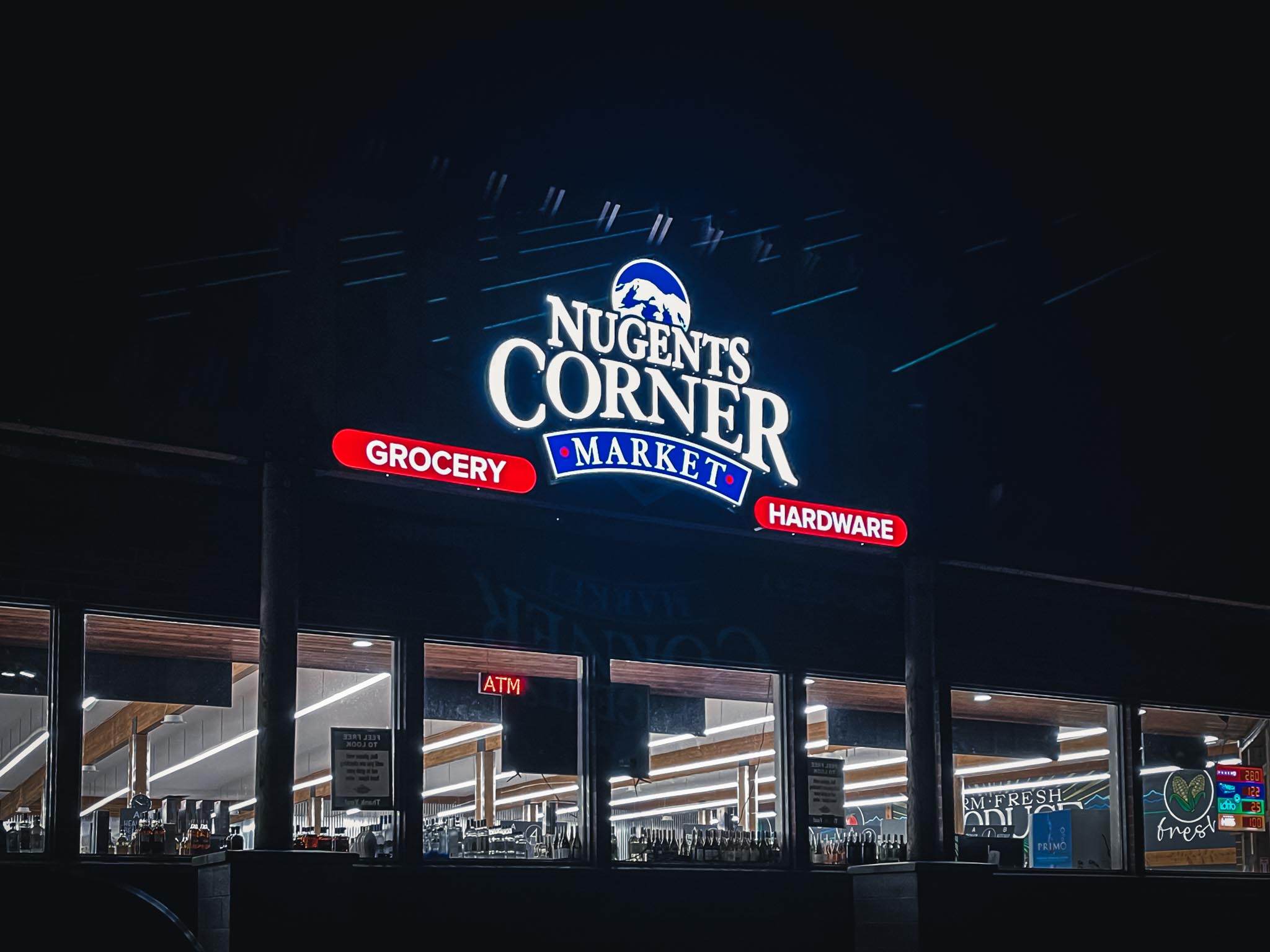 grocery-nugents-corner-Illuminated-channel-letter-sign-at-night