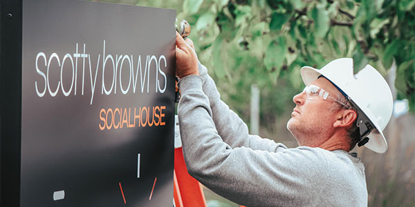 Sign worker servicing a sign